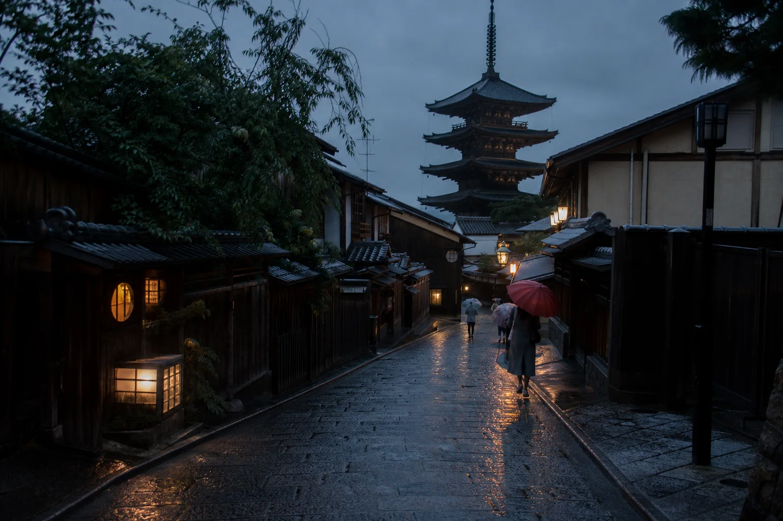 Rain falling on a traditional Kyoto street beneath a pagoda